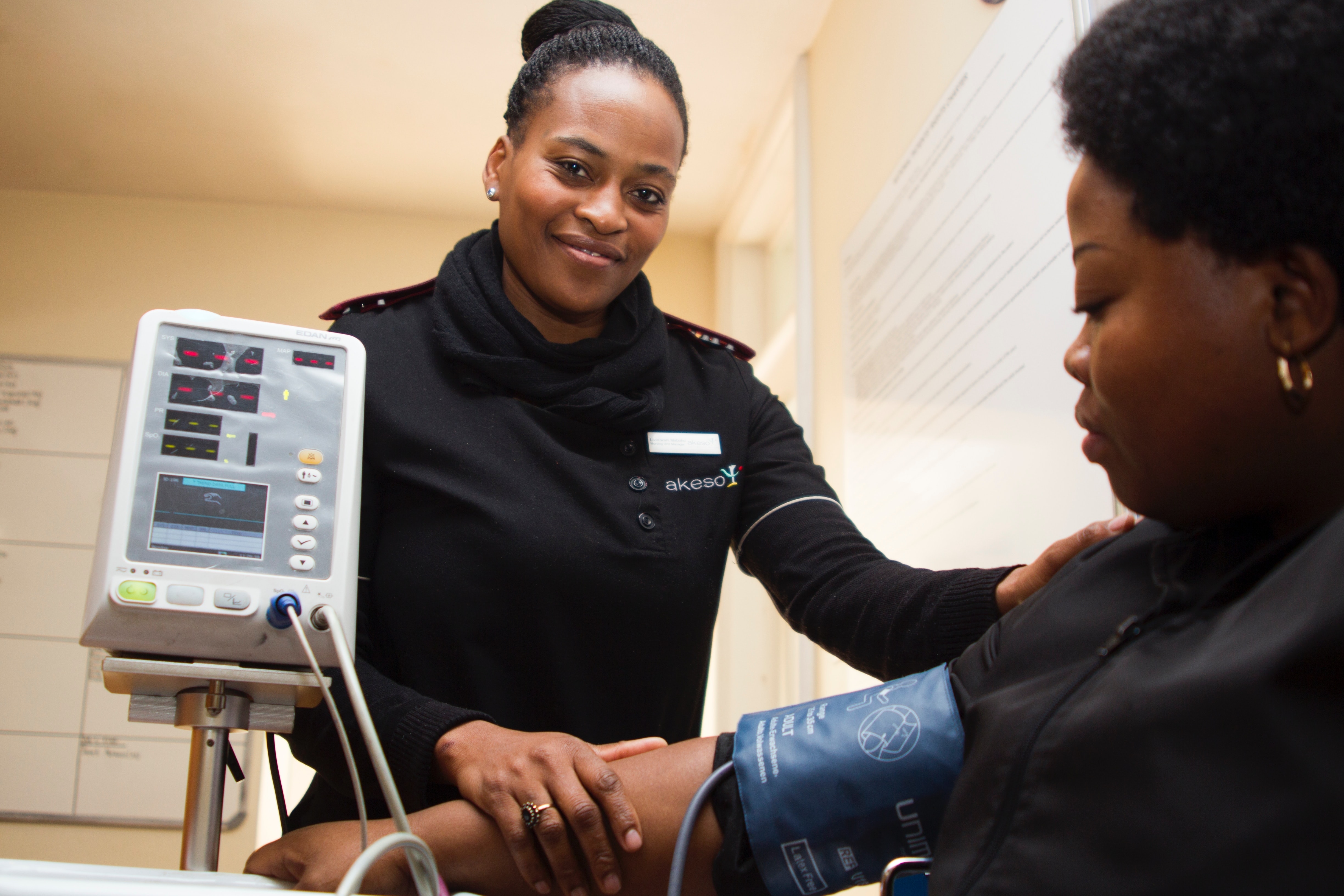 a picture of a nurse taking a blood pressure reading